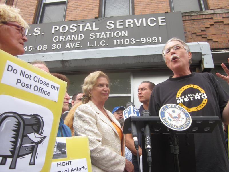 Rep. Carolyn Maloney (center), with a postal employee in Astoria